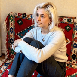 Emma-Jane MacKinnon-Lee late at night with a glowing screen